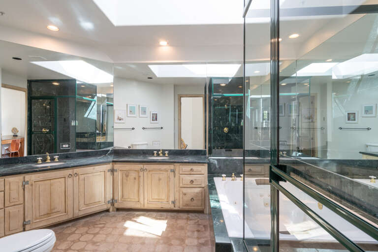 Master bathroom's over sized jetted Jacuzzi tub, double vanities and walk in steam shower. Master bathroom's over sized jetted Jacuzzi tub, double vanities and walk in steam shower.