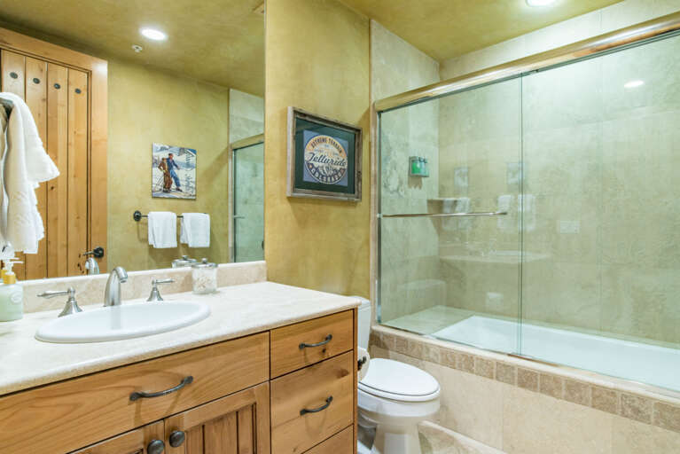 King ensuite bathroom with shower and tub.