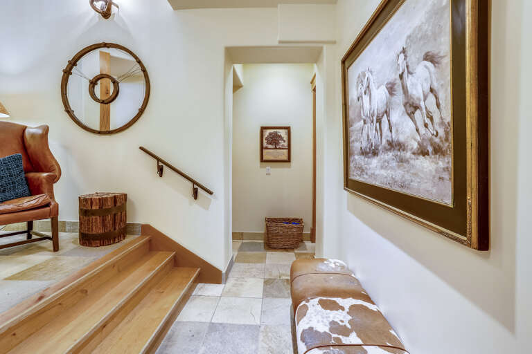 Hallway on lower level with three bedrooms on this level (2nd master, King suite and bunk room). Main Master is on the top level.