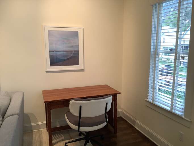 Desk and a comfortable chair upstairs.