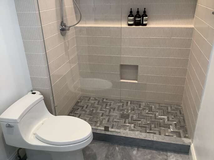 All new upstairs shower with Aesop bath amenities.