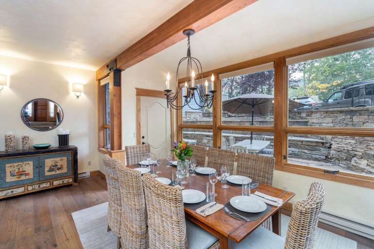 Dining room area with view of private terrace. Seating for 8 guests.  Adjoins kitchen and living room.