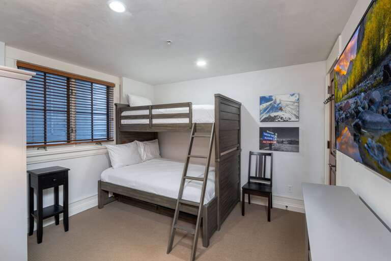 Bunk room with Full size bed on the bottom and Twin on top.