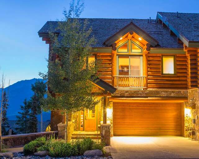 Amazing Days from the front with 4 parking spaces. Two in the garage and two in front of the garage with more nearby!