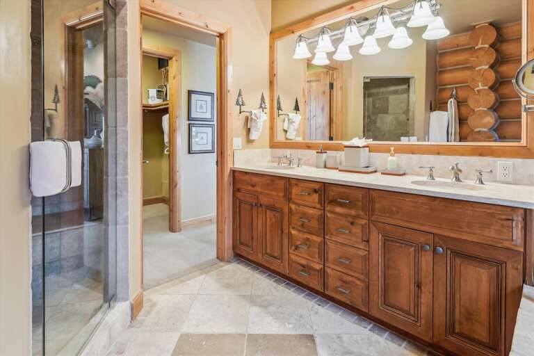 Entry Level Master bathroom with walk in steam shower, Jacuzzi tub and double vanity.