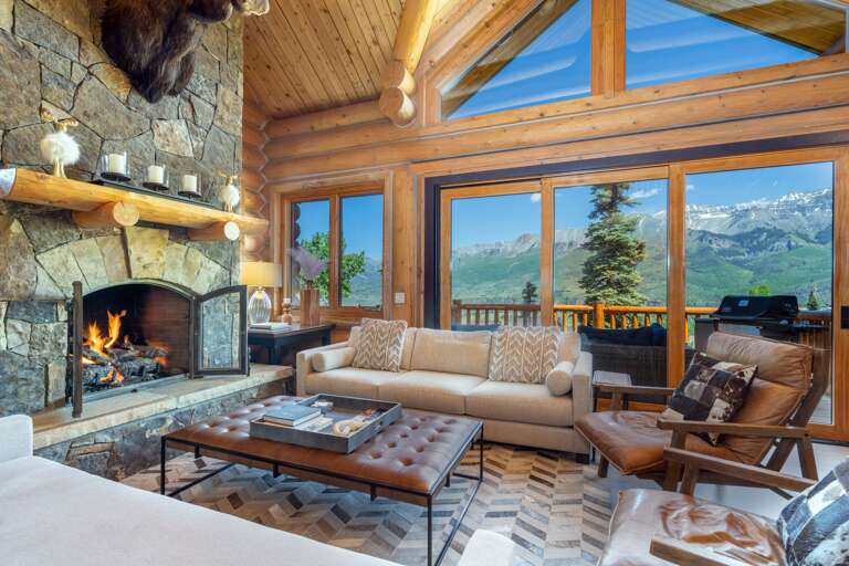 Main Level - Living area with a spectacular fireplace, and magnificent views. The entire home is newly re-decorated in a contemporary mountain style. Main Level - Living area with a spectacular fireplace, and magnificent views. The entire home is newly re-decorated in a contemporary mountain style.