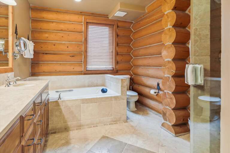 Entry Level master bathroom with Jacuzzi tub.