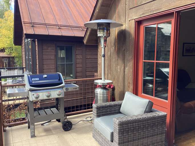 New gas grill, new propane heater and new furniture on outdoor deck.