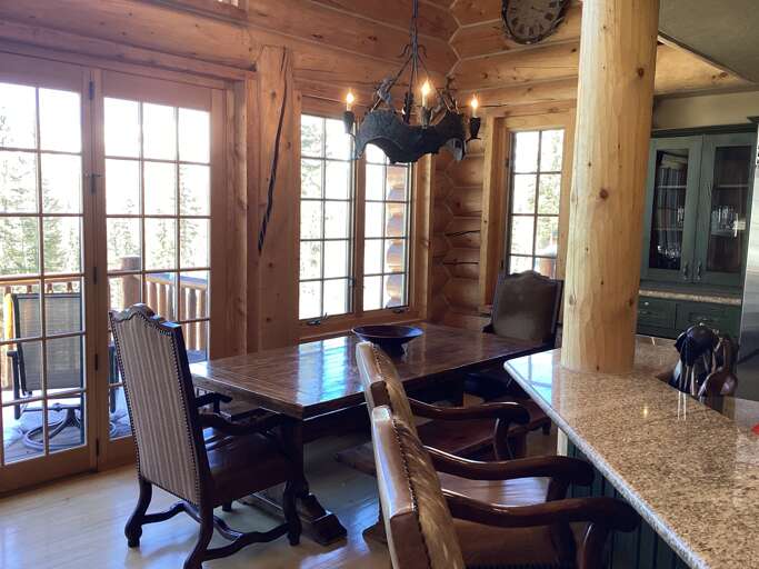 Dining area sits 8 and also two wide bar stool chairs at the kitchen counter. Dining area sits 8 and also two wide bar stool chairs at the kitchen counter.