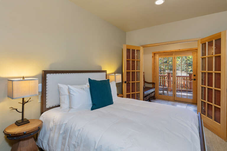 Queen guest suite with French doors and sun deck.  Ensuite bathroom Queen guest suite with French doors and sun deck.  Ensuite bathroom