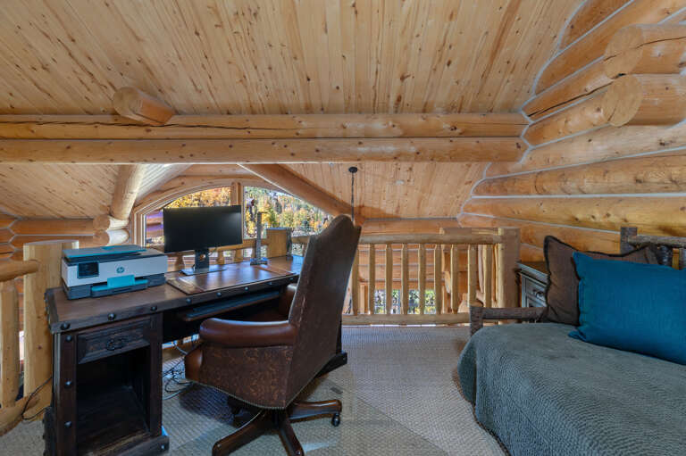 Loft area with an office and a Day Bed for 1 guest