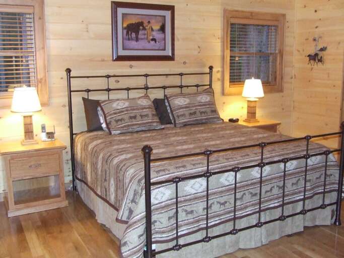 KING BED LOCATED IN THE MAIN LEVEL BEDROOM