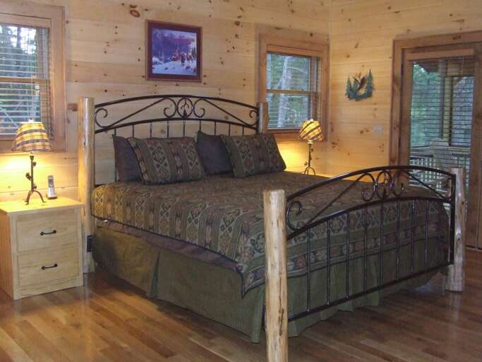 KING SIZE BED LOCATED IN THE MASTER BEDROOM LOCATED ON THE UPPER FLOOR THE ADJOINING MASTER BATH HAS A JACUZZI TUB AND CUSTOM TILE SHOWER