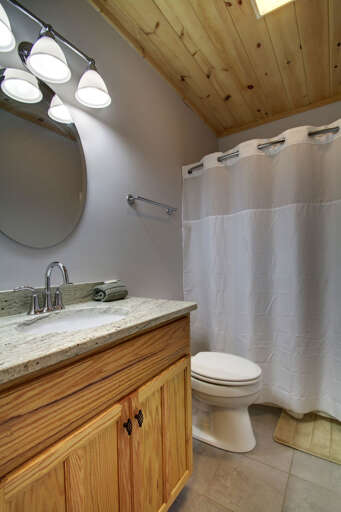 The lower level bathroom has a shower/tu combo.