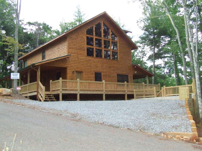 This cabin offers a wall of windows for your beautiful mountain view.