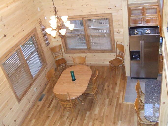 FROM THIS VIEW YOU CAN SEE THE OPEN AREA THE KITCHEN AND DINING ROOM OFFERS.