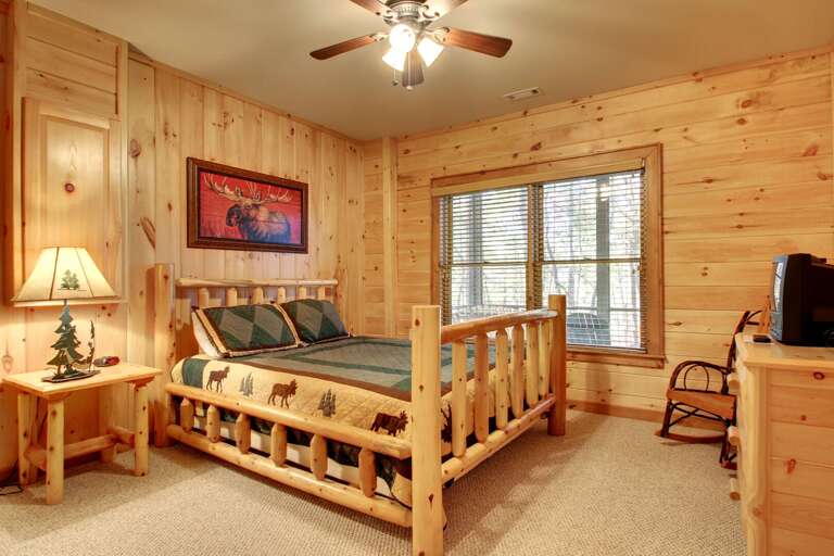 Downstairs Bedroom offers a Queen Bed and TV with a playstation for your children to enjoy