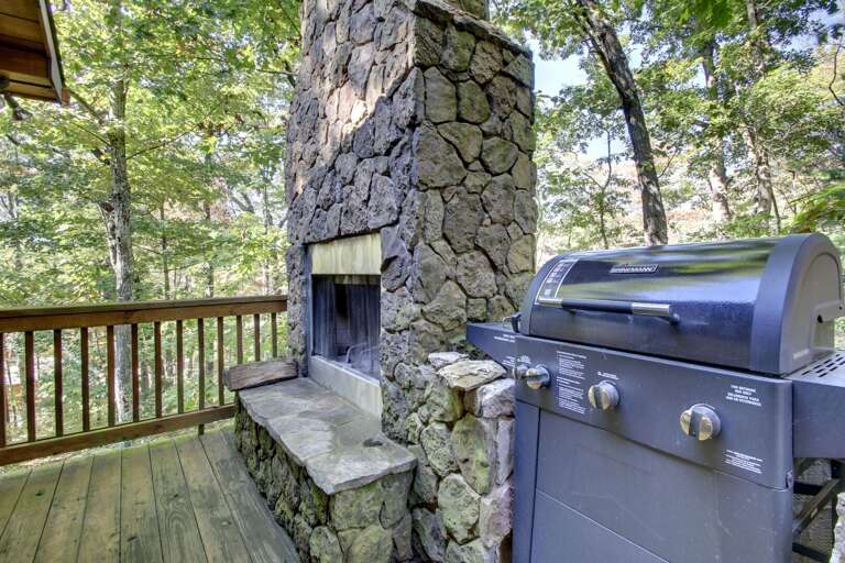 ENJOY A WARM WOODBURNING FIRE IN THE OUTDOOR FIREPLACE OR COOK YOUR FAVORITE MEAL ON THE GAS GRILL LOCATED ON THE DECK.
