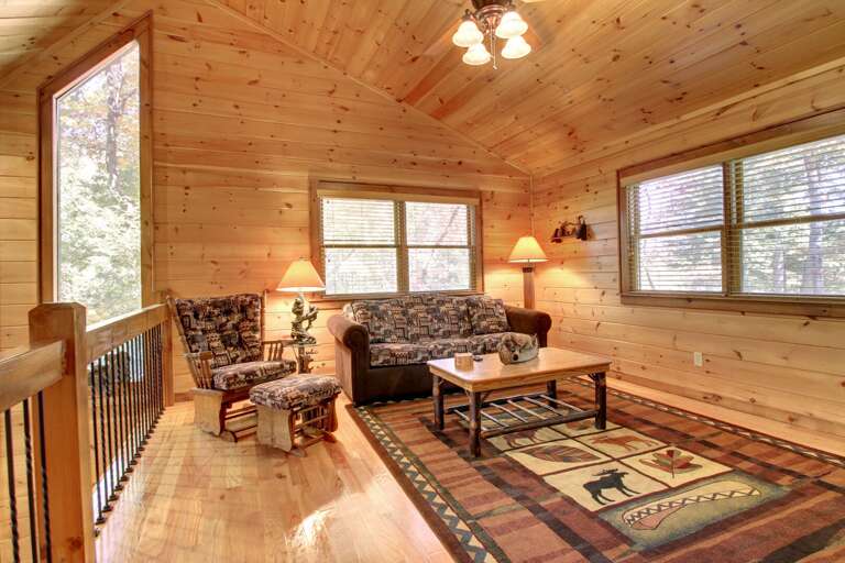 Loft Area offers a great quiet time and sitting area and this couch is a  Sleeper Sofa and also a TV