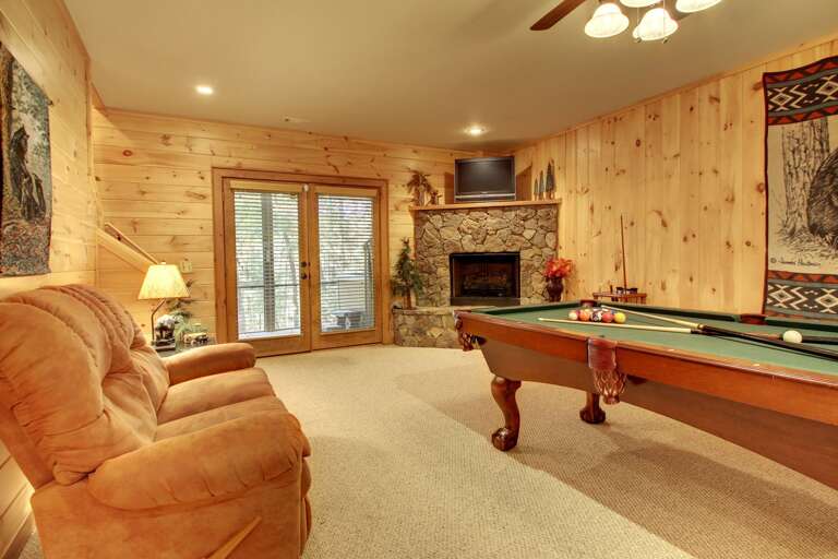 Enjoy a game of Pool or a Movie or just sit back by the gas burning fireplace. There is also access to the Hot Tub Patio from the family room. Enjoy a game of Pool or a Movie or just sit back by the gas burning fireplace. There is also access to the Hot Tub Patio from the family room.