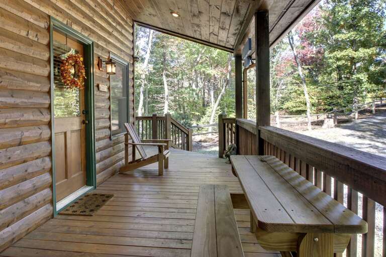 The front porch has a small picnic bench where you can enjoy a snack. The front porch has a small picnic bench where you can enjoy a snack.