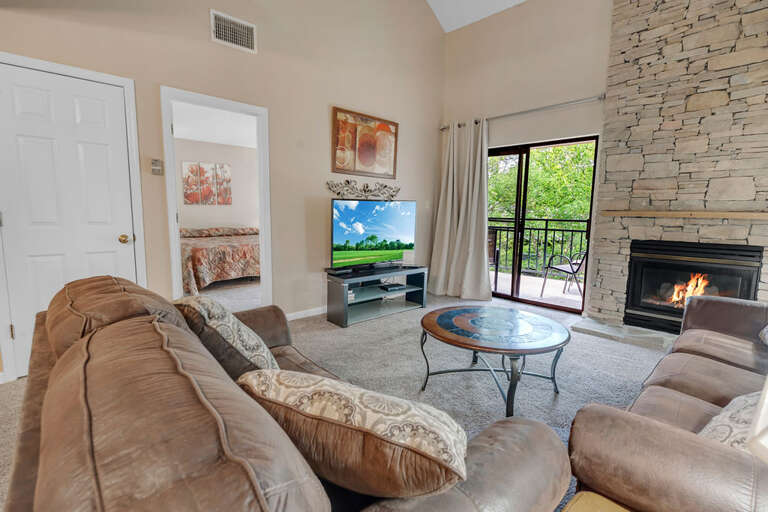 Living Room With Fireplace And TV In Vacation Rental Living Room With Fireplace And TV In Vacation Rental