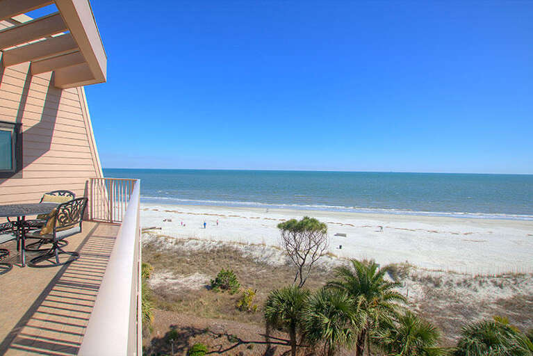 Balcony View Of Breezy Beach And Boundless Ocean