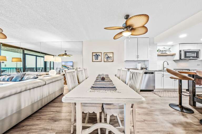 The dining room offers seating for 8 at the table (with the 2 end chairs not in this photo) as well as 3 barstools - perfect for family meals and gatherings