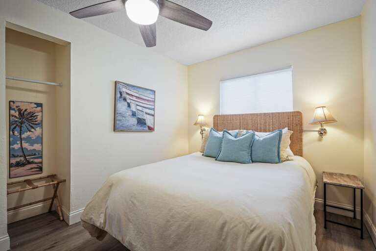 The guest bedroom features a cozy queen bed, offering a comfortable retreat for your visitors