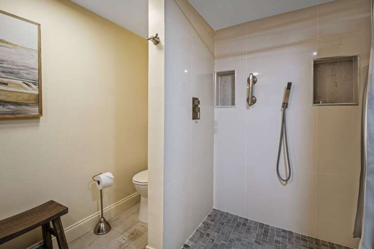 Indulge in the beautiful tile shower in the master bathroom, designed for both style and functionality