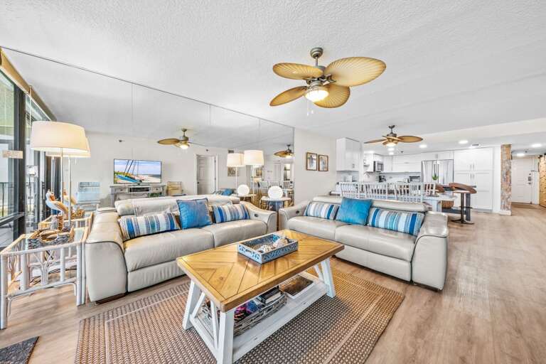 Relax in ultimate comfort with automatic reclining couches in the living room, perfect for unwinding after a day at the beach