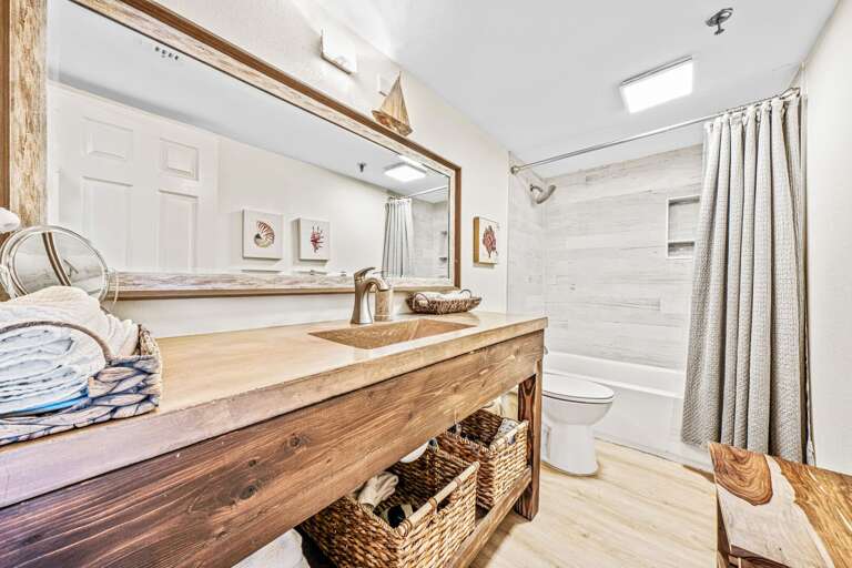 The updated guest bathroom features a tub/shower combo