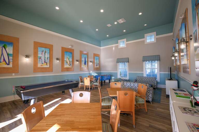 Clubhouse with tables, chairs, and games Clubhouse with tables, chairs, and games