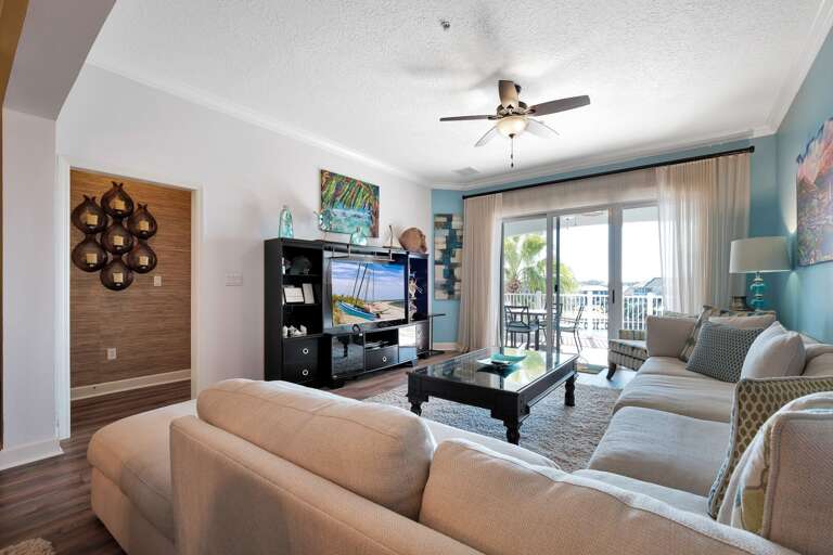 Comfortable living room featuring a large TV for your entertainment Comfortable living room featuring a large TV for your entertainment