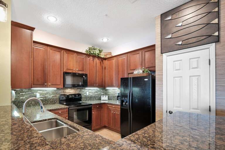 Fully updated kitchen featuring sleek granite countertops Fully updated kitchen featuring sleek granite countertops