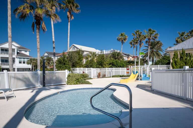Kids' area featuring a kiddie pool and a playground Kids' area featuring a kiddie pool and a playground