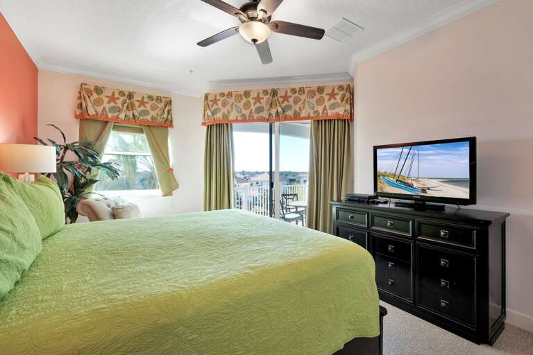 The master bedroom features a king bed and a TV The master bedroom features a king bed and a TV