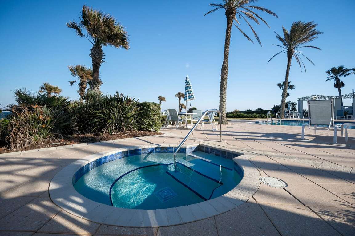 Unwind in the hot tub, conveniently located on the pool deck for ultimate relaxation Unwind in the hot tub, conveniently located on the pool deck for ultimate relaxation