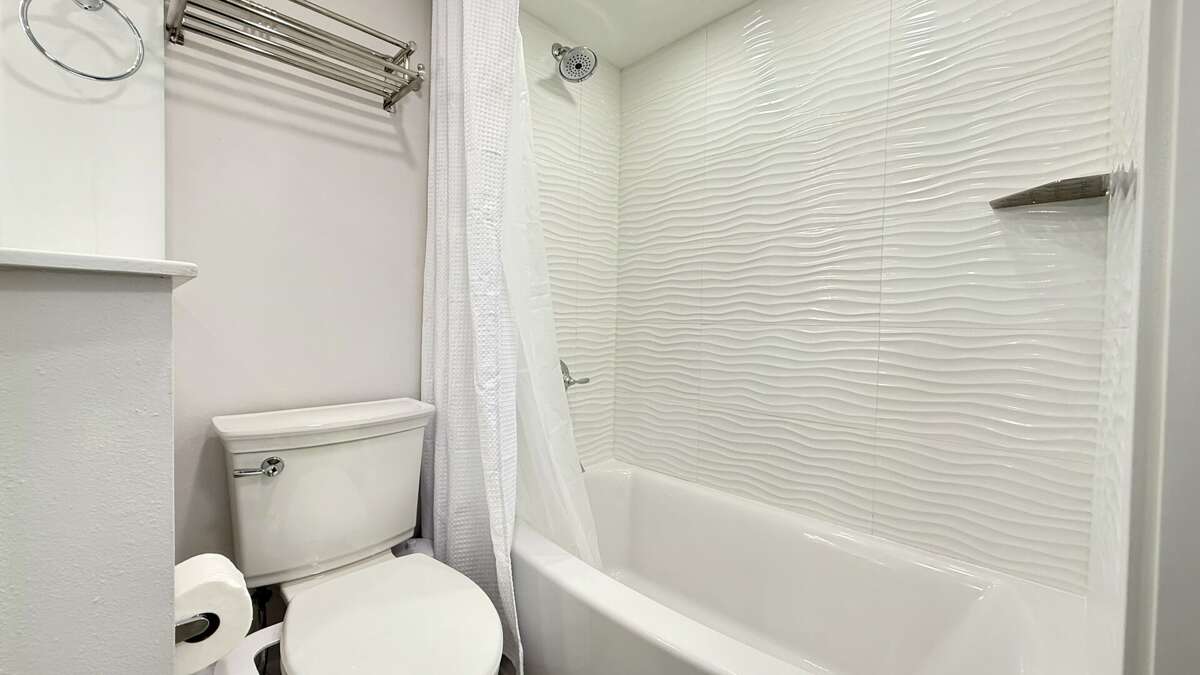 Bathroom with a tub/shower combo—perfect for a quick shower or a relaxing soak Bathroom with a tub/shower combo—perfect for a quick shower or a relaxing soak