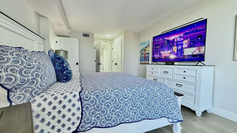 Bedroom featuring a large smart TV for your entertainment and relaxation Bedroom featuring a large smart TV for your entertainment and relaxation