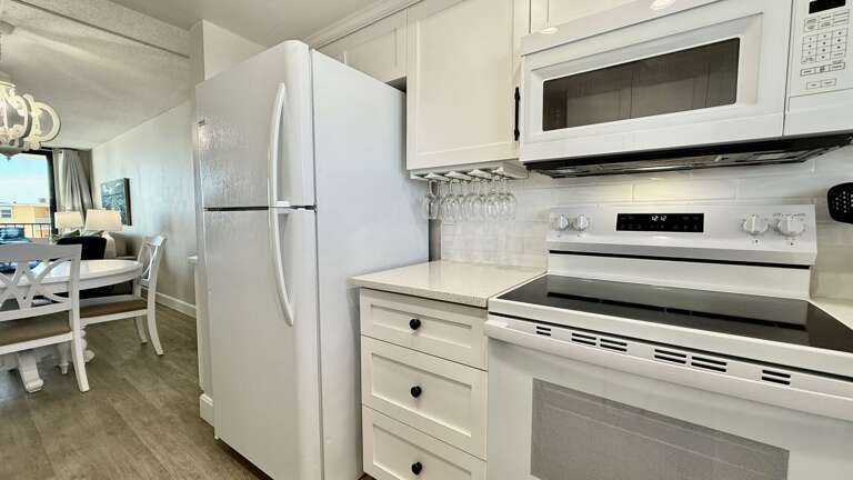 Fully equipped kitchen stocked with everything you need for your vacay, including wine glasses for vino lovers Fully equipped kitchen stocked with everything you need for your vacay, including wine glasses for vino lovers