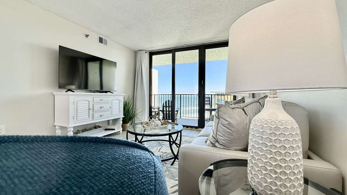 Living room with a large smart TV, queen memory foam sleeper sofa, and stunning Atlantic Ocean views Living room with a large smart TV, queen memory foam sleeper sofa, and stunning Atlantic Ocean views
