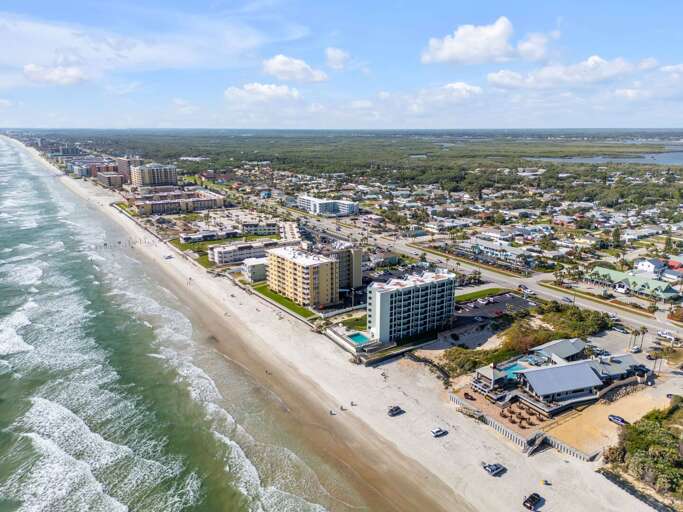 Ocean Trillium Suites is just steps from the sand, perfectly located right on New Smyrna Beach for the ultimate coastal getaway