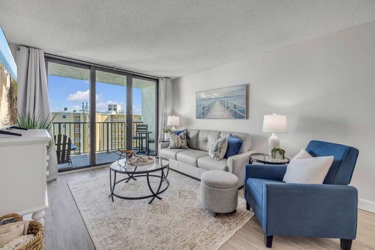 The ocean-view living room is the ideal place to unwind after a day at the beach