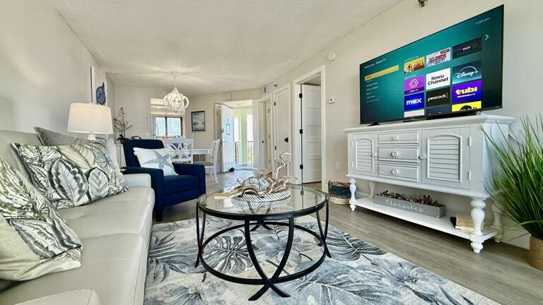 Relax in the comfortable living room with a large smart TV for your entertainment Relax in the comfortable living room with a large smart TV for your entertainment