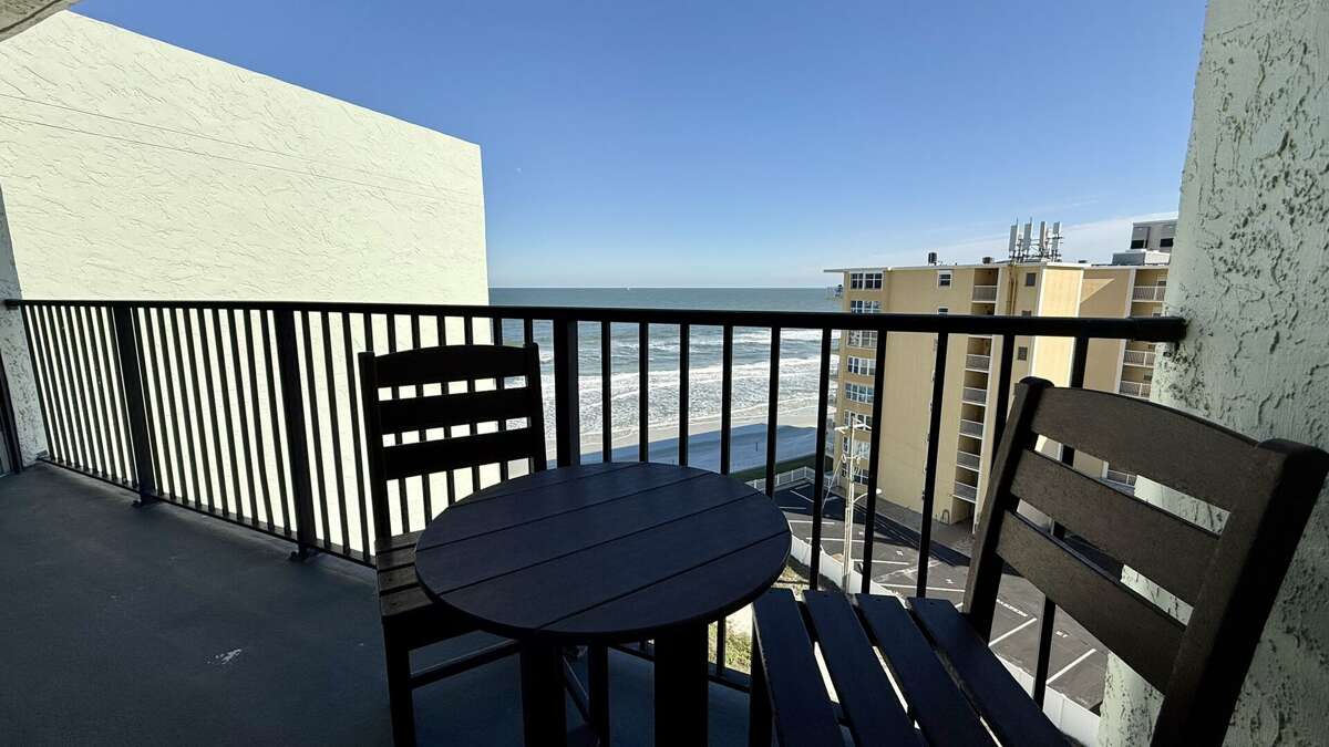 Relax with seating on the balcony, offering beautiful views of the ocean and beach Relax with seating on the balcony, offering beautiful views of the ocean and beach