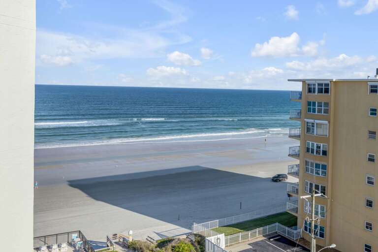 Stunning balcony view of New Smyrna Beach and the Atlantic Ocean from this oceanfront property
