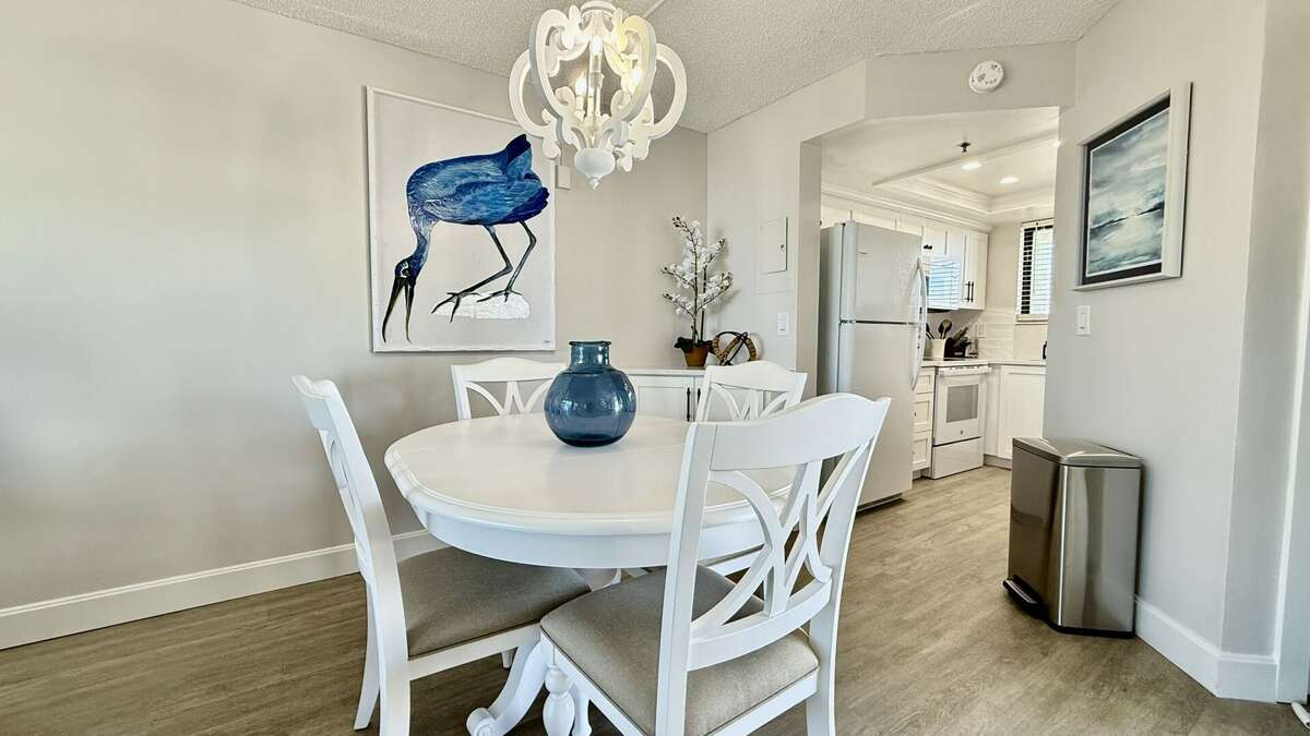 This thoughtfully designed condo features fresh, beachy décor throughout, including a charming ocean-view dining room This thoughtfully designed condo features fresh, beachy décor throughout, including a charming ocean-view dining room