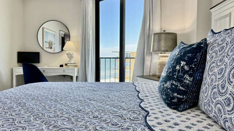 Watch the waves roll in from the comfort of your king bed in the ocean-view bedroom Watch the waves roll in from the comfort of your king bed in the ocean-view bedroom