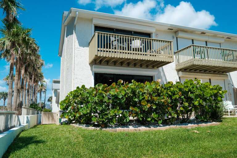 Discover the charm of this cozy townhome at Oceanside Village, just steps from the beach.